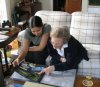 Angela showing off our travel photos to Gramma Dahlman